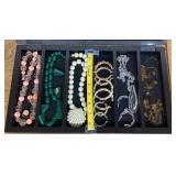 Costume jewelry necklaces and earrings