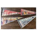 4 assorted hockey pennants