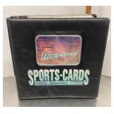 Binder of sports cards in pages