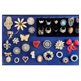 Costume jewelry brooches and rings