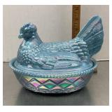 Blue iridescent glass hen on a nest