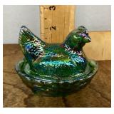 Green iridescent glass hen on nest