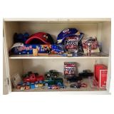 Cabinet contents with NASCAR diecast cars & trucks