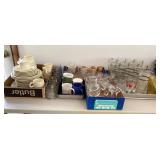 Clean up lot on table with glasses, mugs, dishes