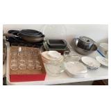 Cleanup lot on table with bakeware and pans
