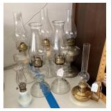 7 oil lamps and chimneys