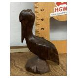 Carved wooden pelican figure