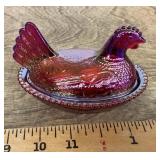 Red carnival glass hen on a nest