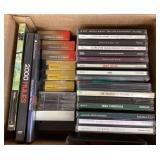 Box of DVDs, tapes, and CDs