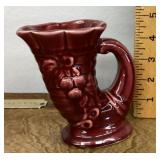 Red pottery cornucopia vase