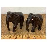 2 carved wooden elephant figures