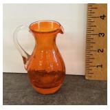Orange glass pitcher