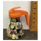 Syrup pitcher filled with buttons
