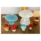 Stone, ceramic, and plastic mushrooms