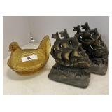 Amber hen on nest & cast iron ship bookends