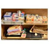 2 shelves with old toys and picture frames