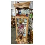 Lighted curio cabinet with mirrored back