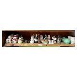 Shelf of vintage salt and pepper shakers