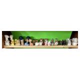 Shelf of vintage salt and pepper shakers