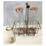 3 milk bottles and carrier