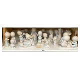 Shelf of Precious Moments figures