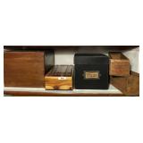 Shelf of wooden boxes w/cheese boxes