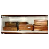 Shelf of wooden boxes with Lane cedar chests