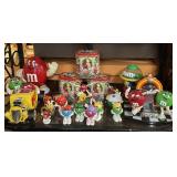 Shelf of assorted M&M collectibles