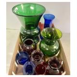 Flat with red, blue, green glass vases
