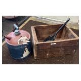 Wooden shipping crate, coal shovel, gas can