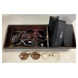 Wooden box with glasses and sunglasses