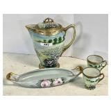 Hand painted porcelain teapot, cups, dish