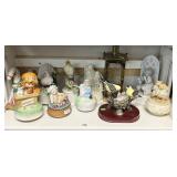 Shelf of music boxes, porcelain birds