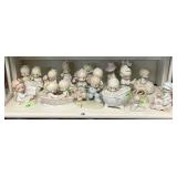 Shelf of Precious Moments figures