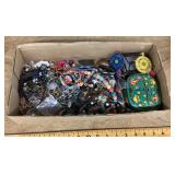 Flat of costume jewelry