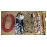 4 costume jewelry necklaces