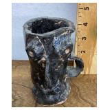 Pottery face mug