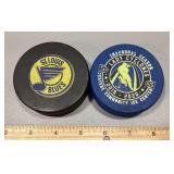 Pair of hockey pucks
