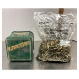 Sealed bag and tin of Remington .22 ammo