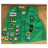 Girl Scout vest with patches and insignia