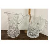 2 clear glass pitchers