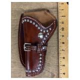Leather gun holster with decorative metal studs
