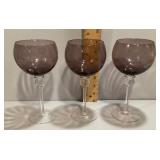 3 purple glass wine goblets