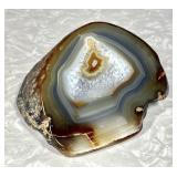 Polished cut face banded agate specimen 5" dia.
