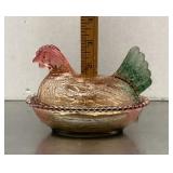 Multicolor glass hen on a nest