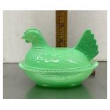 Green glass hen on a nest