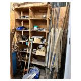Shelving Unit with contents: Hitches, electrical parts, misc