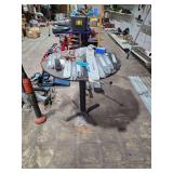 Lot - Table and Contents: Assorted Chainsaw Guide Bars, Masonry Drill Bits, and Staples