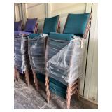 Green stackable cushioned upholstered chairs,