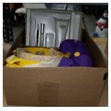 Box of yellow bowls and  D&C products